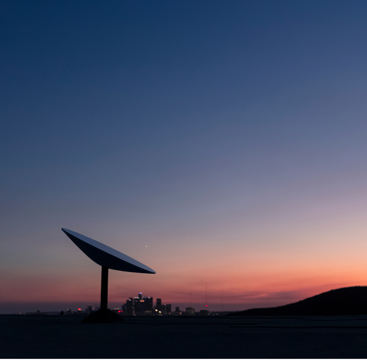 starlink satellite on a hilltop, photo taken at dawn