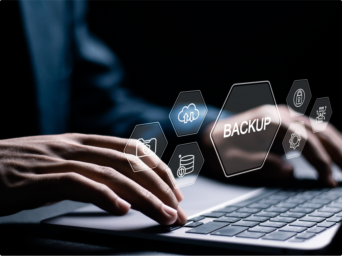 Image of a laptop keyboard with fingers typing and an overlay of hexagon shapes with the word "Backup"