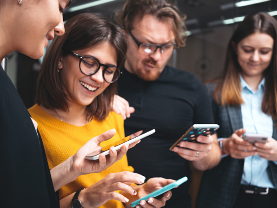 Photo of a group of people on their mobile phones