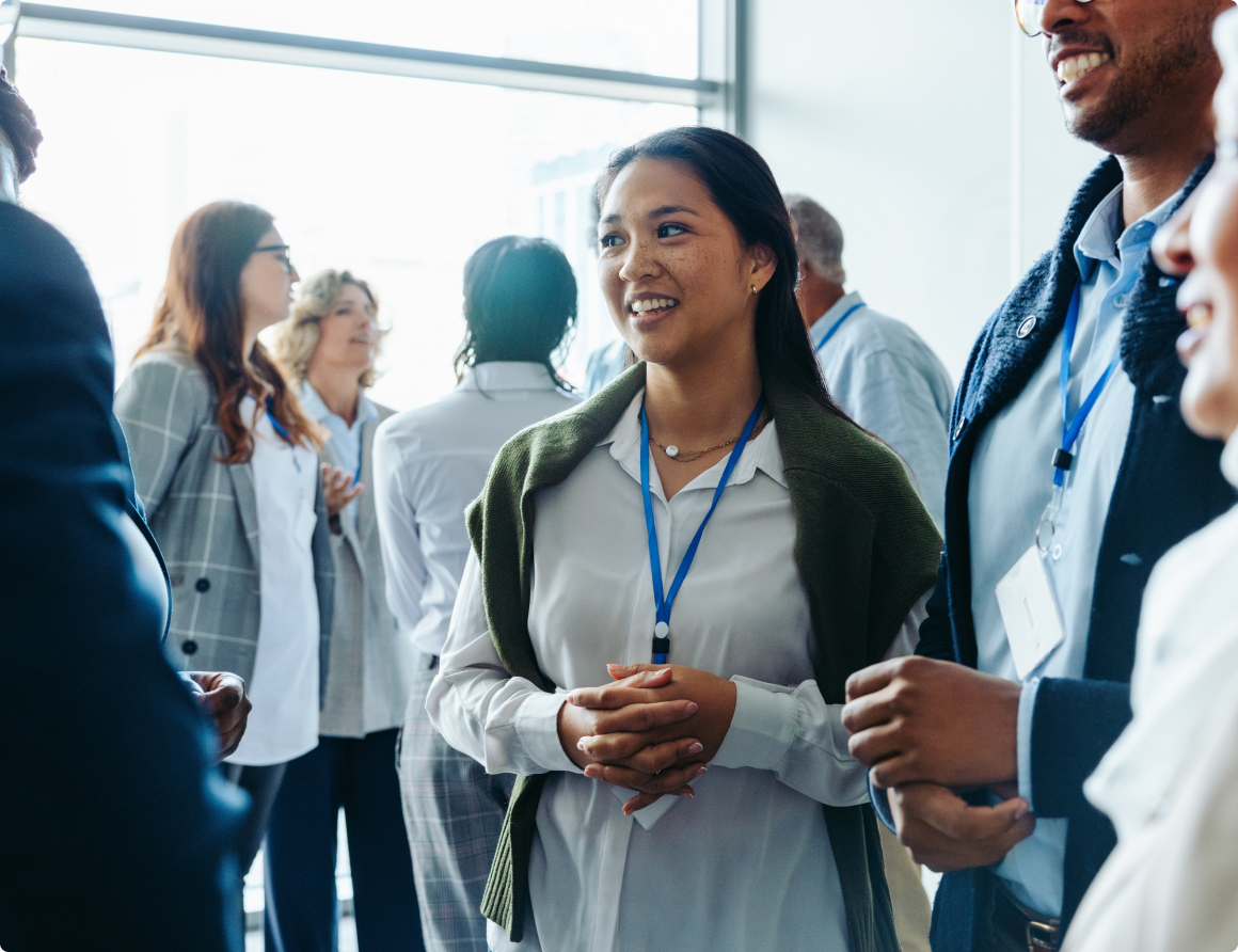 Image of a group of people attending a group conference and networking