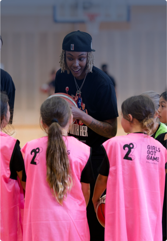 Photo of a coach talking to her team in the Girls Got Game Programme