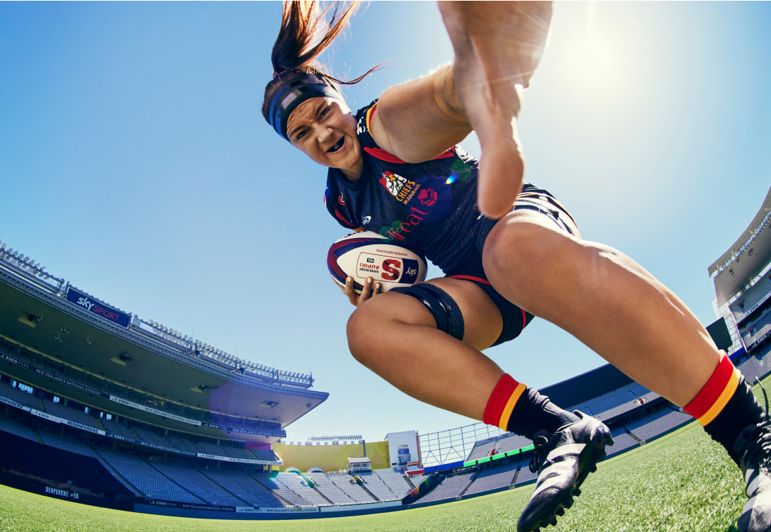 Image of woman playing rugby