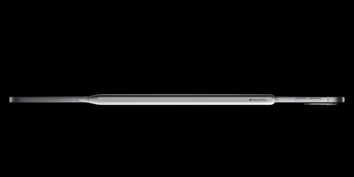Image of an iPad pro showing the thickness and an apple pencil